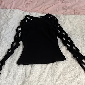 Black top with crossover sleeves